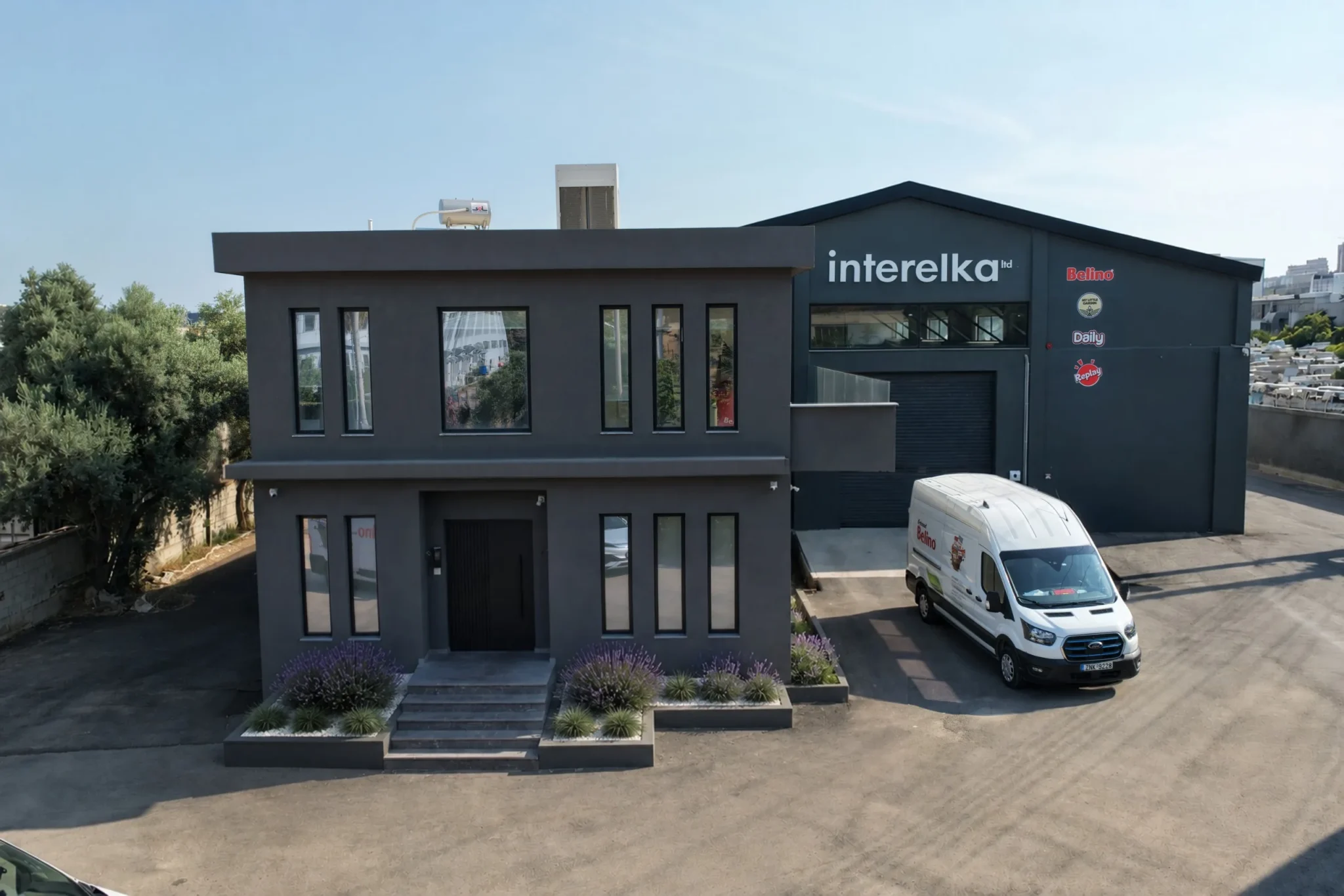 The Interelka headquarters and warehouse in Koropi, with a branded delivery van outside