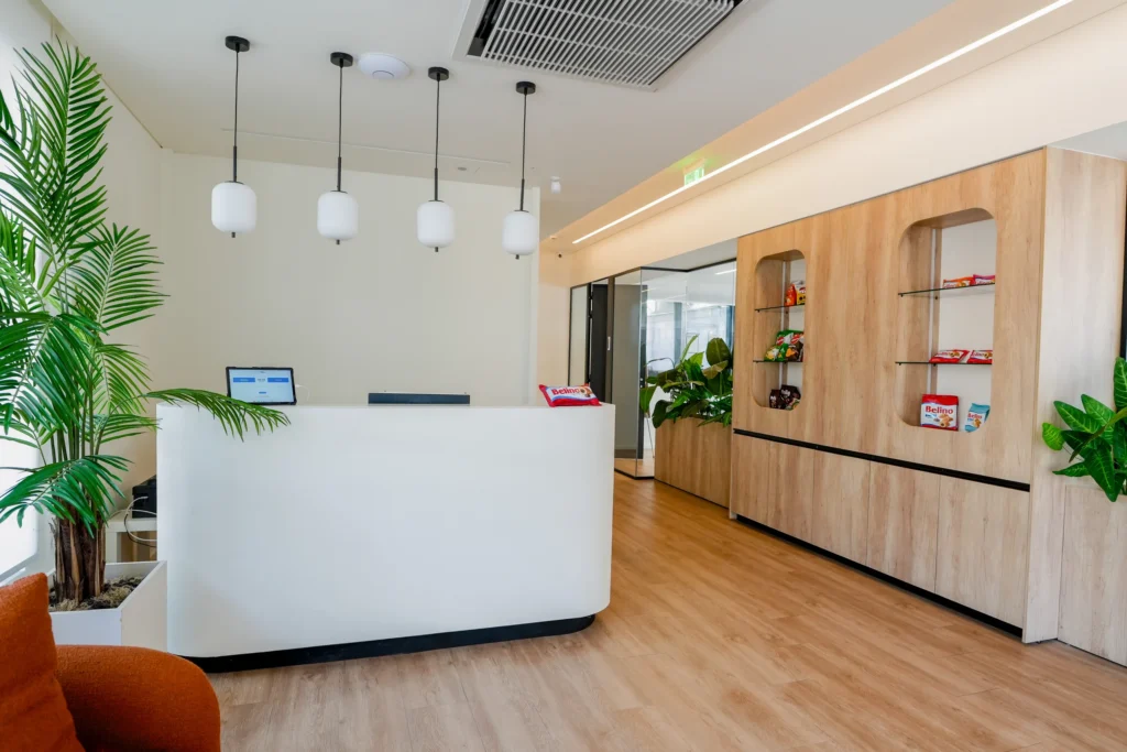 Reception desk at the Interelka offices, with the product display joinery behind it