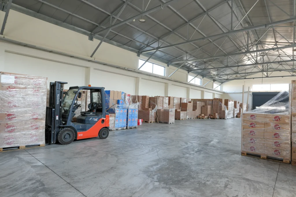 Forklift moving pallets in the Interelka warehouse in Koropi