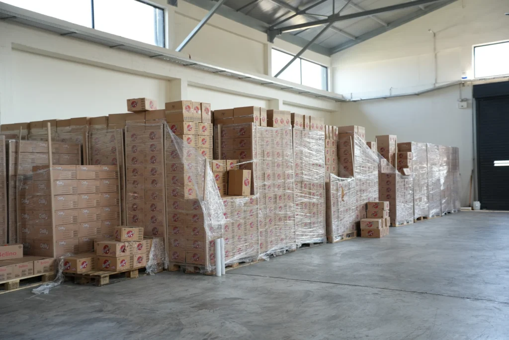 Stacked pallets across the Interelka warehouse floor