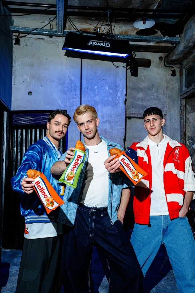 Three young people holding Belino croissant packs