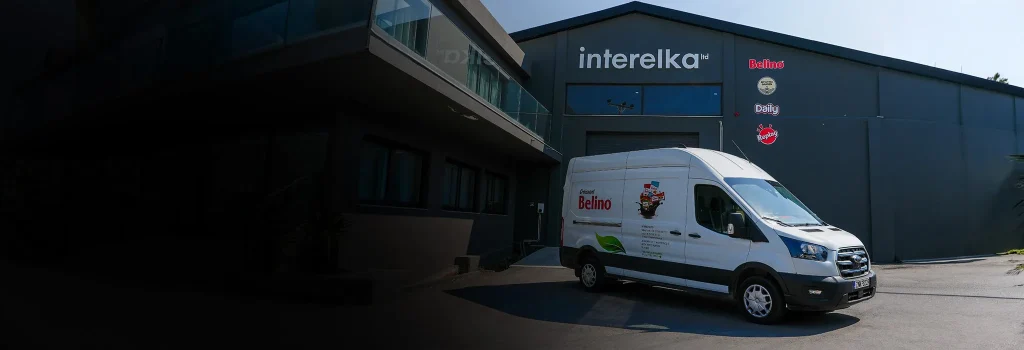 The Interelka building in Koropi with a Belino-branded delivery van parked outside