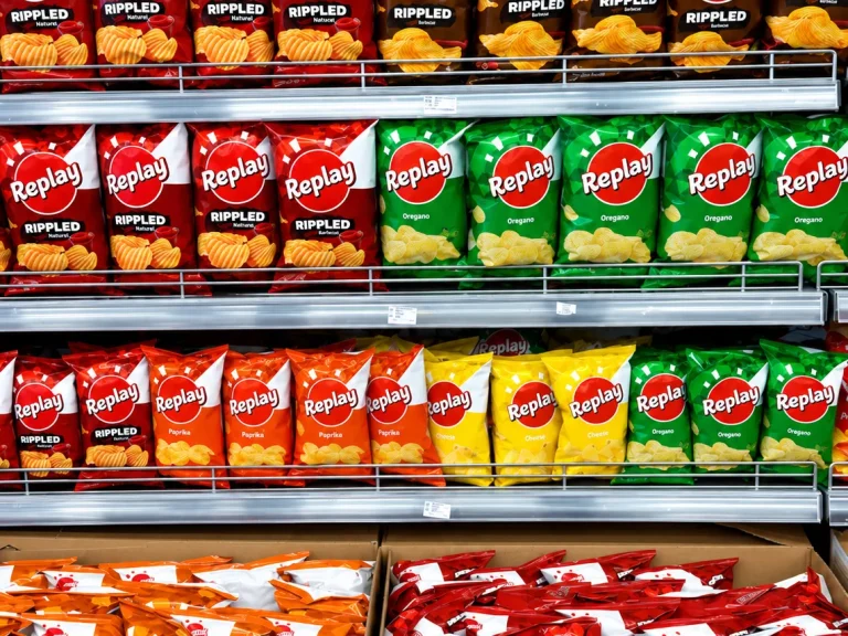 Replay crisps arranged across supermarket shelves