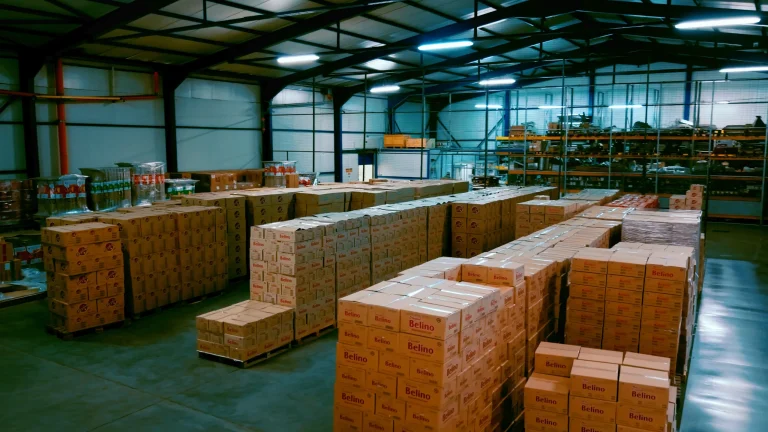 Pallets of Belino cartons stacked across the warehouse floor